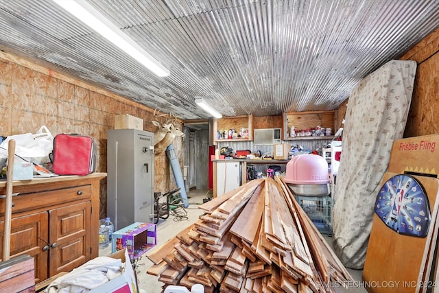 miscellaneous room with wooden walls