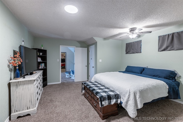 bedroom with ceiling fan, a textured ceiling, and carpet