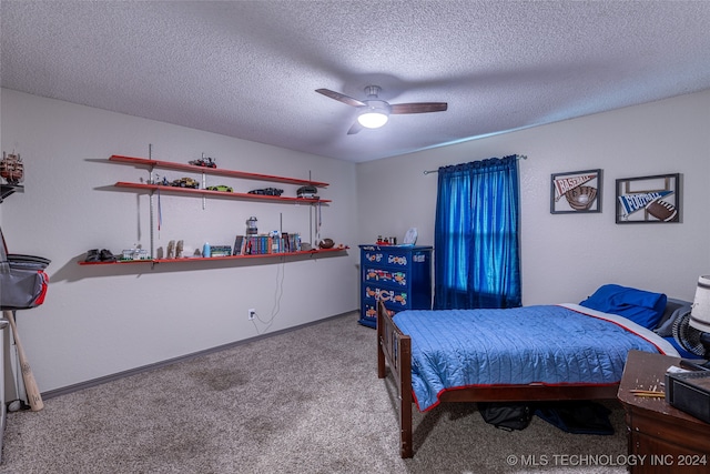 carpeted bedroom featuring ceiling fan and a textured ceiling