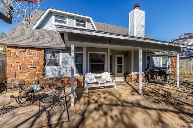 rear view of property with a patio