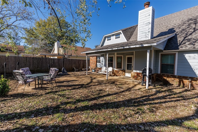 back of house with a patio