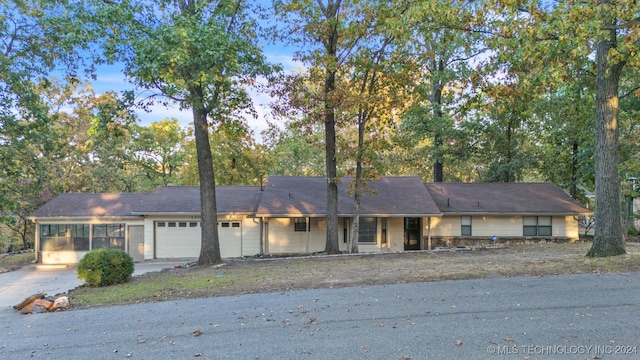 single story home with a garage