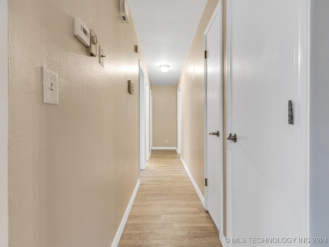 corridor featuring light wood-type flooring