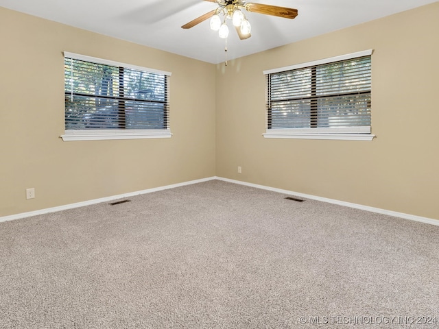 carpeted empty room with ceiling fan