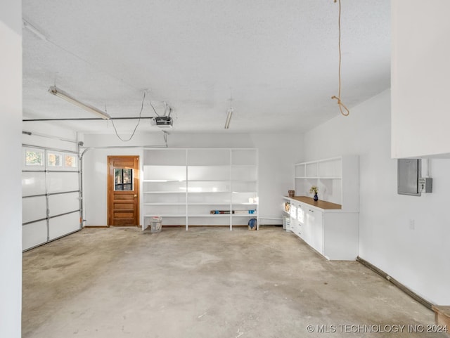 garage featuring a garage door opener and electric panel