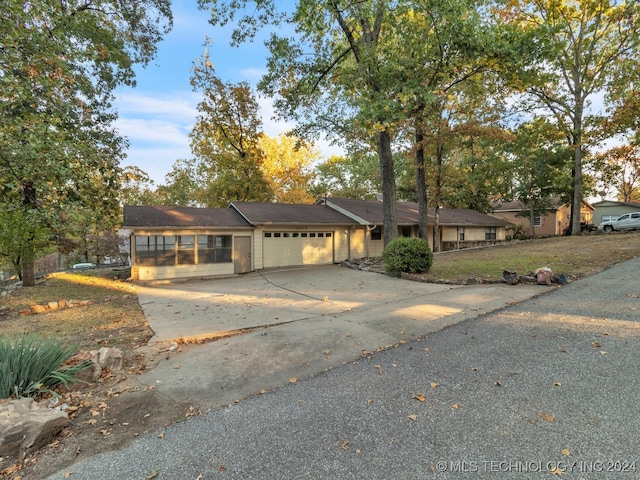 ranch-style house featuring a garage