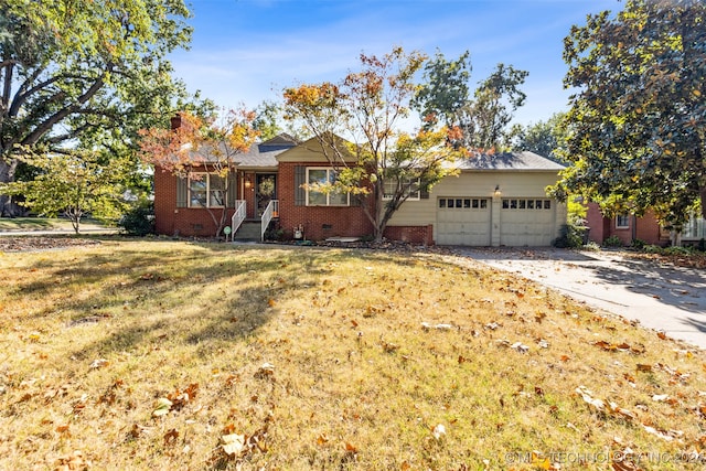 single story home with a front yard and a garage