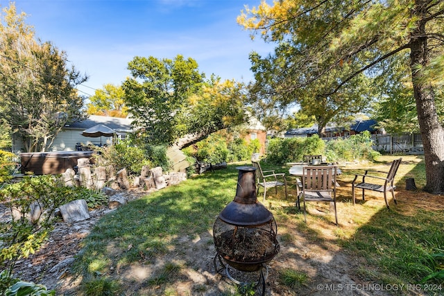 view of yard with a fire pit