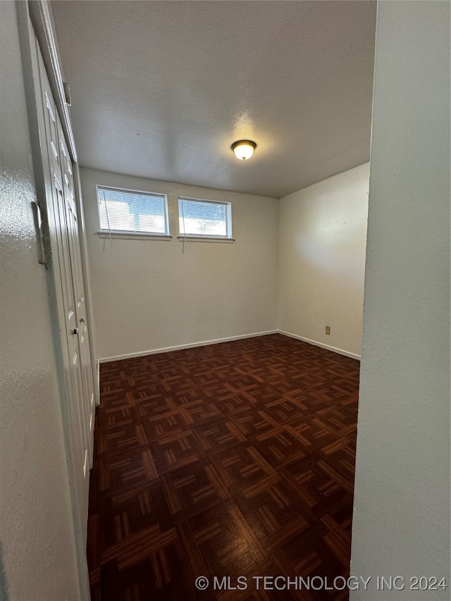 empty room featuring a textured ceiling