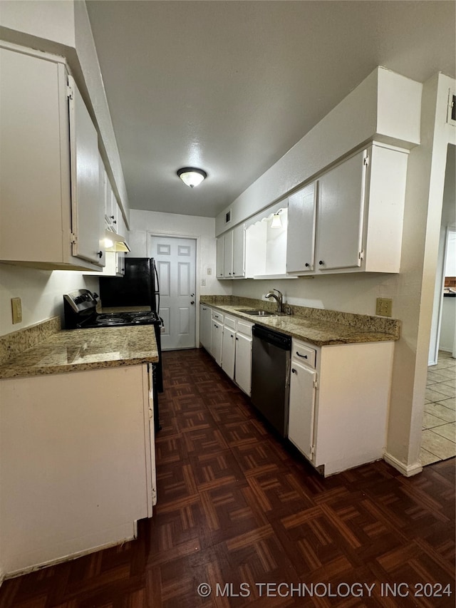 kitchen featuring light stone counters, white cabinets, stainless steel dishwasher, and dark parquet floors