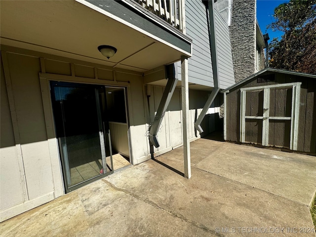 view of patio / terrace with a storage unit