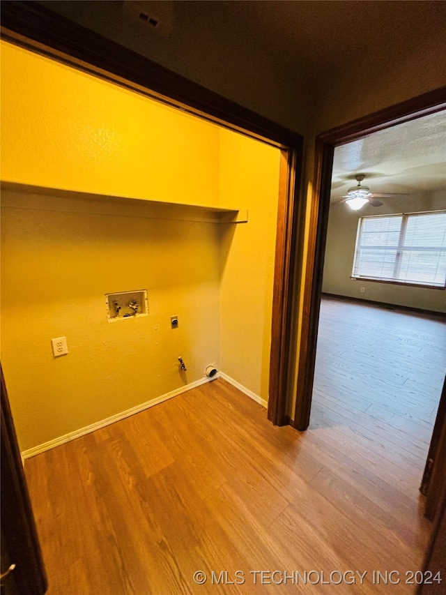 laundry area with washer hookup, ceiling fan, electric dryer hookup, wood-type flooring, and hookup for a gas dryer