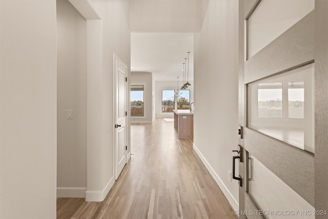 hallway with light wood-type flooring