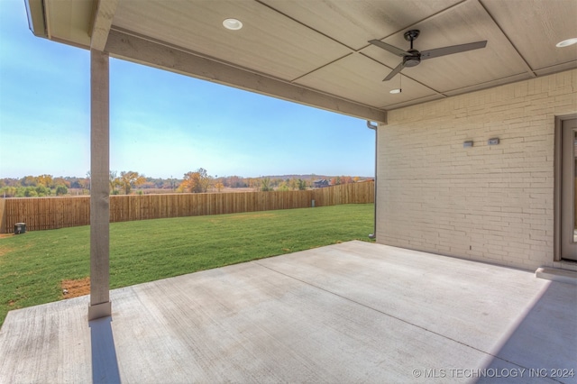 view of patio featuring ceiling fan