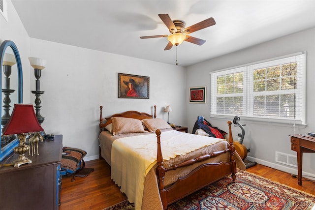 bedroom with ceiling fan and wood-type flooring