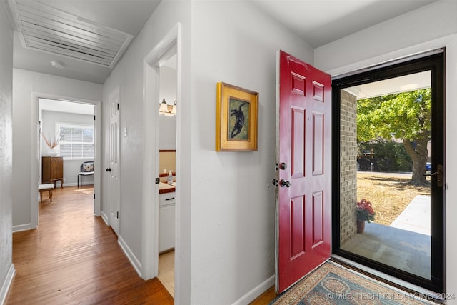 foyer entrance with hardwood / wood-style floors