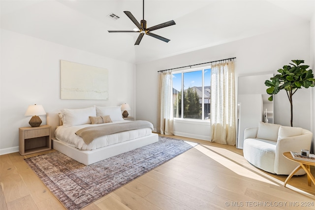 bedroom with ceiling fan and wood-type flooring