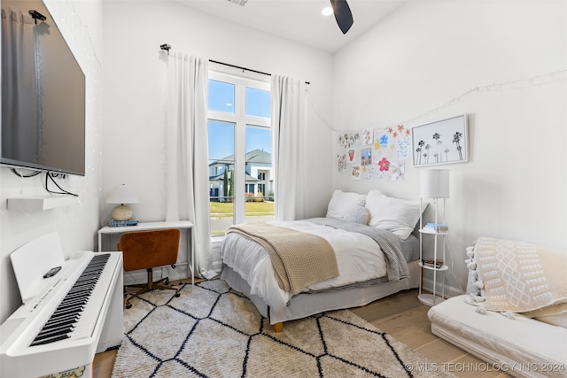 bedroom with light wood-type flooring and ceiling fan