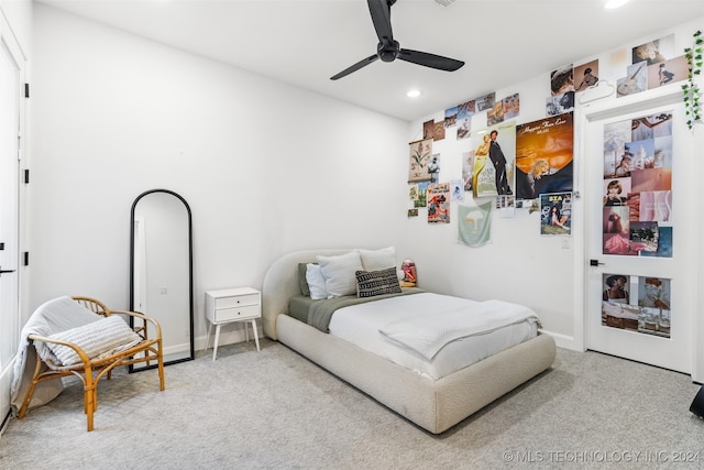 bedroom featuring ceiling fan and carpet