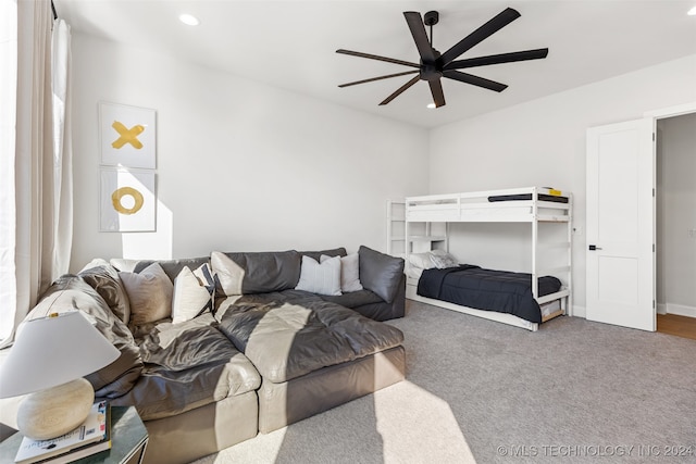 carpeted bedroom with ceiling fan