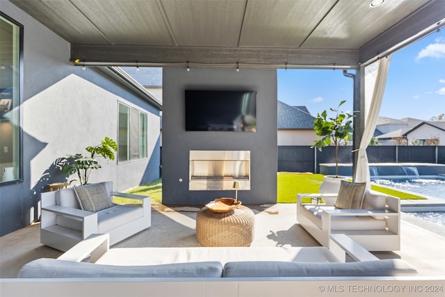 view of patio featuring an outdoor living space and a pool