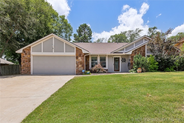 single story home with a front yard and a garage