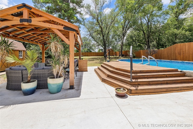 view of swimming pool featuring a gazebo and a patio area