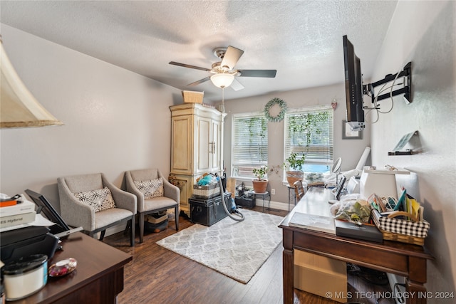 office space featuring dark hardwood / wood-style floors, a textured ceiling, and ceiling fan