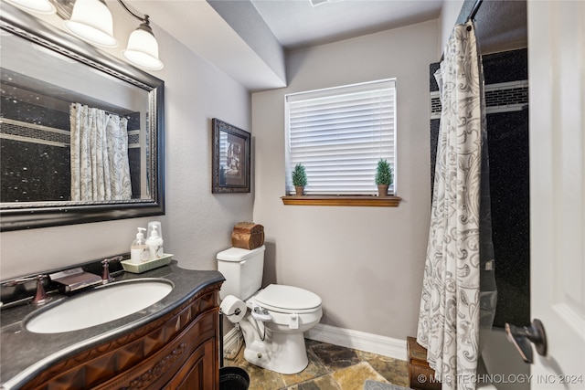 bathroom featuring vanity, toilet, and a shower with shower curtain