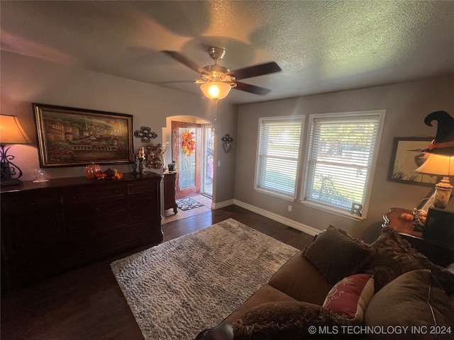 bedroom with access to outside, ceiling fan, a textured ceiling, and dark hardwood / wood-style flooring