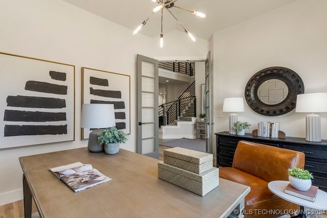 interior space with wood-type flooring and an inviting chandelier