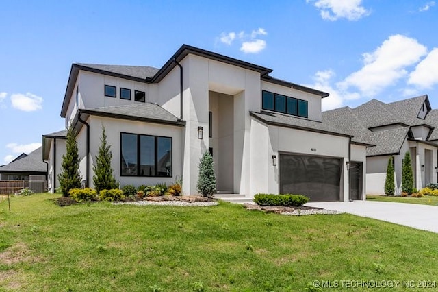 modern home with a front yard and a garage