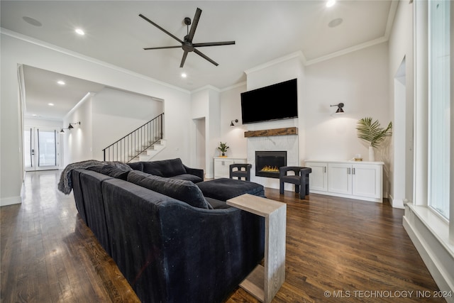 living room featuring crown molding, dark hardwood / wood-style floors, and ceiling fan