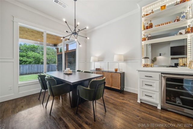 dining room featuring ornamental molding, dark hardwood / wood-style floors, an inviting chandelier, and beverage cooler