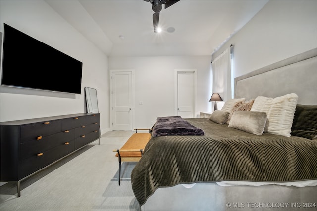 bedroom featuring light carpet