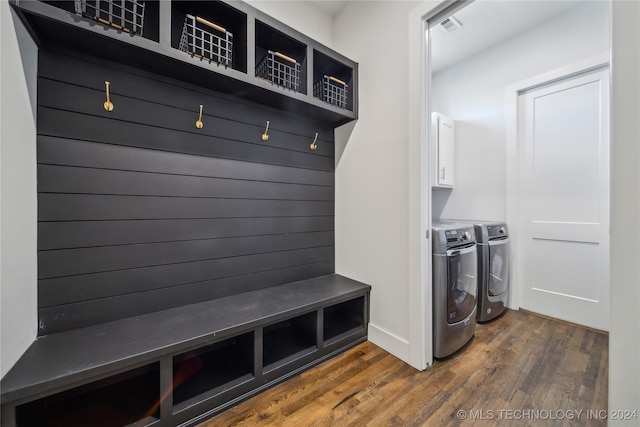 mudroom with dark hardwood / wood-style floors and separate washer and dryer