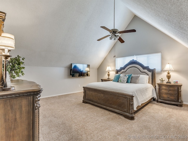 bedroom featuring carpet, ceiling fan, a textured ceiling, and vaulted ceiling