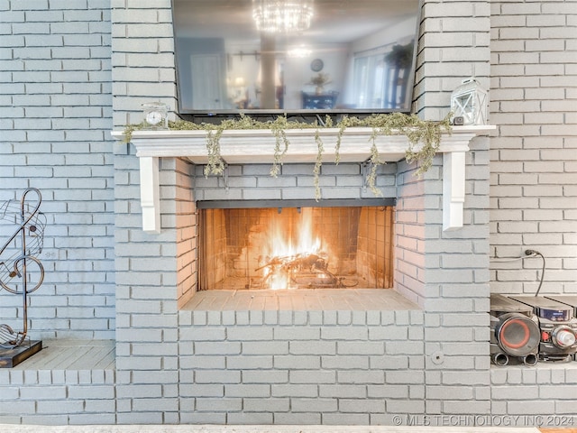 details featuring a brick fireplace