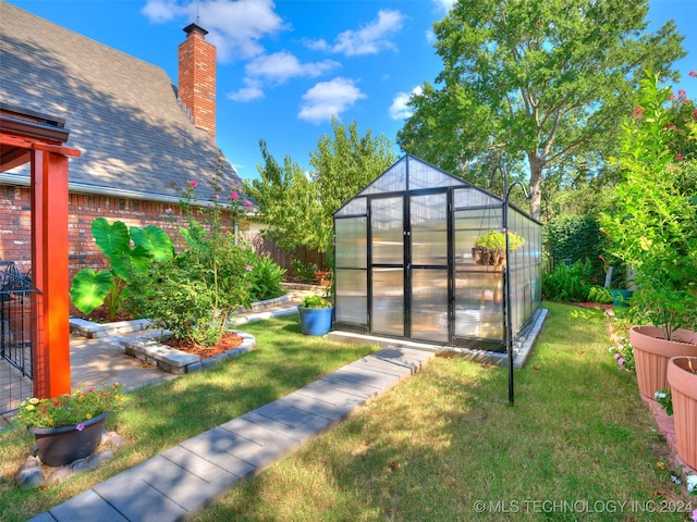 view of outbuilding with a yard