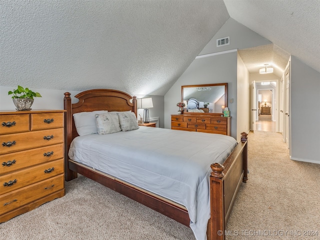 bedroom featuring light colored carpet, a textured ceiling, and vaulted ceiling