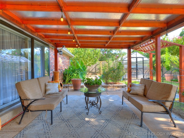 view of patio / terrace featuring an outdoor hangout area and a storage unit