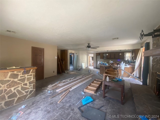 living room featuring ceiling fan