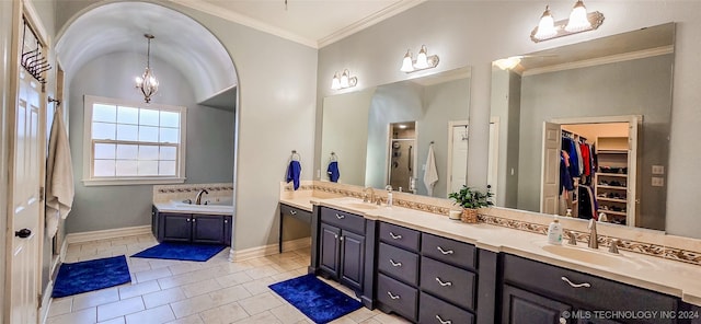 bathroom with tile patterned floors, crown molding, an inviting chandelier, vanity, and a bath