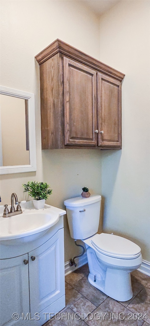 bathroom with toilet and vanity