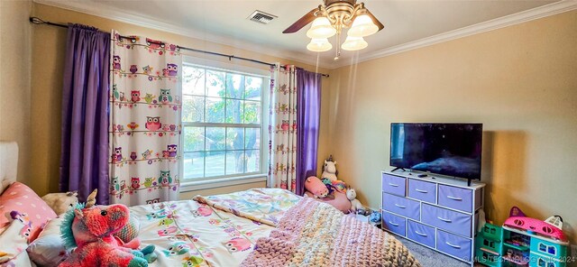 bedroom with crown molding, carpet floors, and ceiling fan