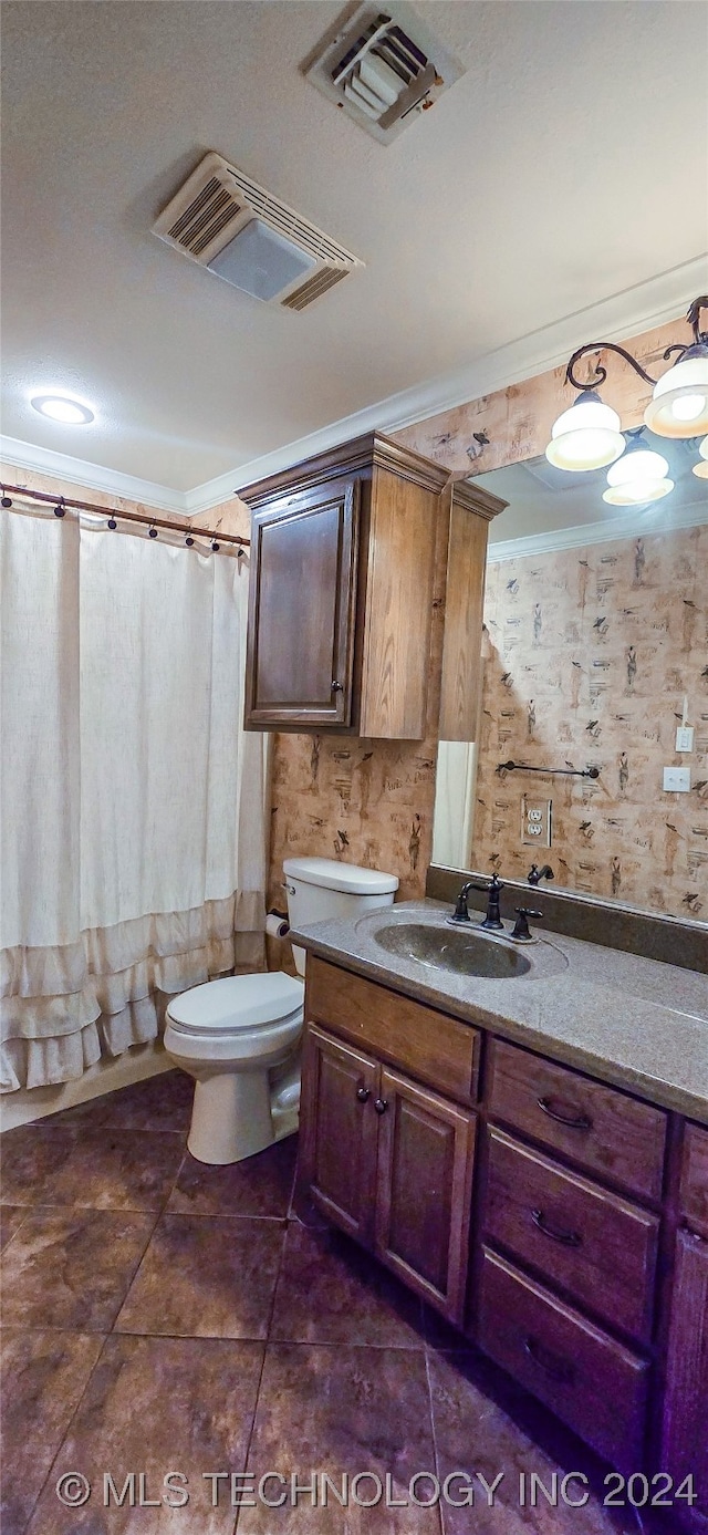 bathroom featuring toilet, walk in shower, tile patterned floors, vanity, and crown molding