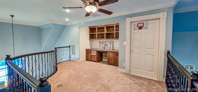 hallway with ornamental molding and light colored carpet