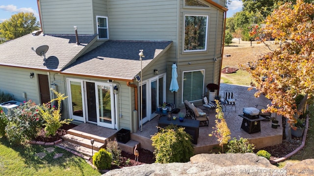 back of property with a patio and outdoor lounge area