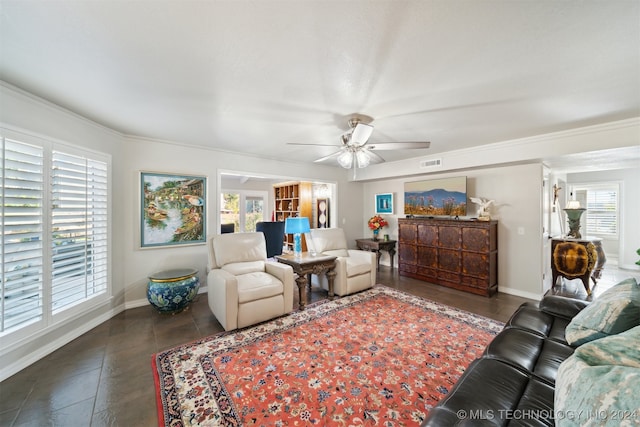 living room with ceiling fan, crown molding, and plenty of natural light