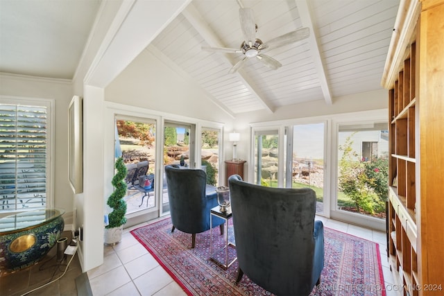 sunroom / solarium featuring vaulted ceiling with beams and ceiling fan